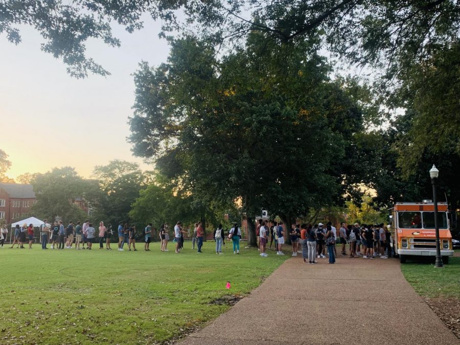 line on alumni lawn in front of food truck