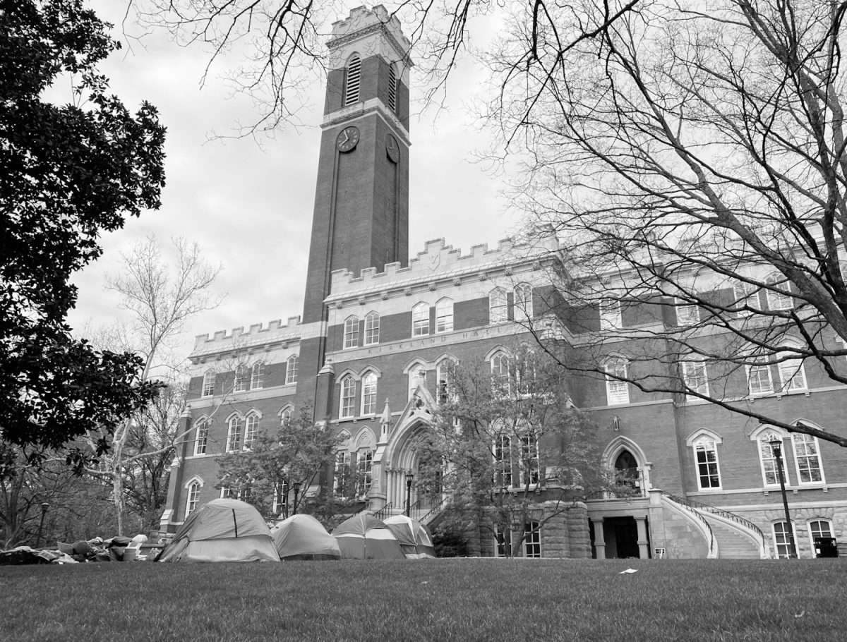 Black-and-white photograph of Kirkland Hall with tents in front of it, as photographed on April 4, 2024. (Hustler Multimedia/George Albu)
