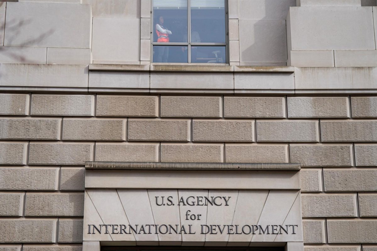 A worker looks out of the window of the U.S. Agency for International Development (USAID) building, after billionaire Elon Musk, who is heading U.S. President Donald Trump's drive to shrink the federal government, said work is underway to shut down the U.S. foreign aid agency USAID, in Washington, U.S., Feb. 3, 2025. REUTERS/Kent Nishimura